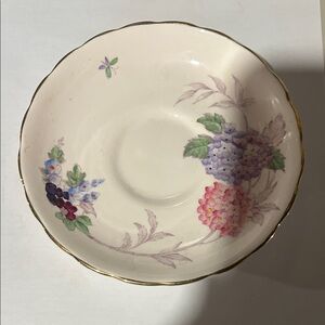 A Tuscan fine bone china saucer with maker's marks and pattern number 8688 H
